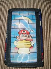 Vintage 1990 Avon Super Mario Bros. trifold wallet holographic design of Mario.