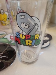 NEW Set of 4 Nintendo Super Mario Drinking Glasses Goomb, Bullet Bill Coasters