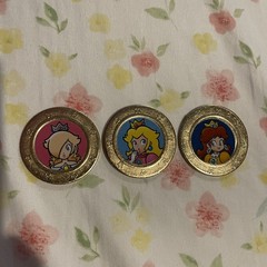 Frankford coins featuring Princess Rosalina, Princess Peach, and Princess Daisy