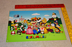 VINTAGE SUPER MARIO BROTHERS +PRINCESS PEACH’S CASTLE 12″ METAL NINTENDO 64 SIGN