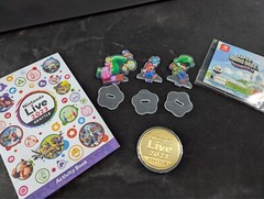 Nintendo Live 2023 Seattle Collectibles Bundle (activity book, coin, standees)